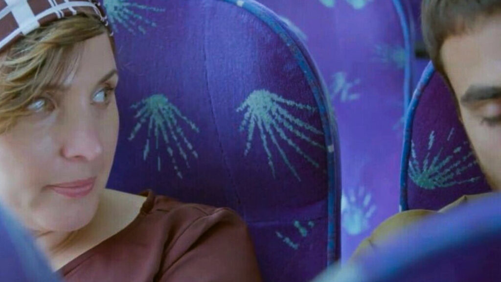 Close view of patterned bus seats in blue fabric